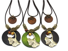 Load image into Gallery viewer, Vintage Ethnic Style Wooden Necklace Large Leaf Round Pendant Sweater Chain