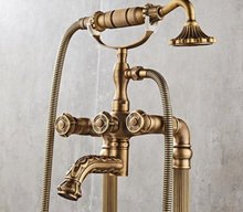 Load image into Gallery viewer, "Arna" Collection - Bathtub Faucet Antique Brass Carved Bath Shower Faucet Hot & Cold Mixer Tap With Handheld Shower Floor Standing Style