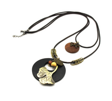 Load image into Gallery viewer, Vintage Ethnic Style Wooden Necklace Large Leaf Round Pendant Sweater Chain
