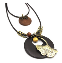 Load image into Gallery viewer, Vintage Ethnic Style Wooden Necklace Large Leaf Round Pendant Sweater Chain
